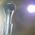 AUD All-Purpose professional dynamic vocal microphone shown from side profile with grille and body detail
