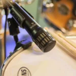 AUD professional 5-piece drum microphone package displayed from side angle showing microphone components
