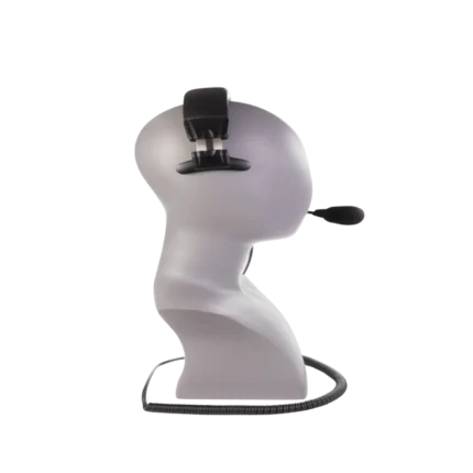 Green-GO single ear headset worn during professional broadcast application in studio setting