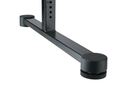 K&M table-style keyboard stand in black positioned with keyboard in professional studio setting
