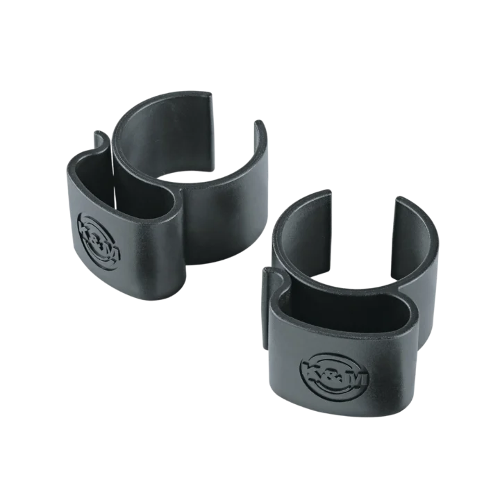 K&M black cable clamps mounted on speaker and lighting stand pole, front view