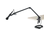 K&M microphone desk arm in black mounted on studio desk with microphone installed