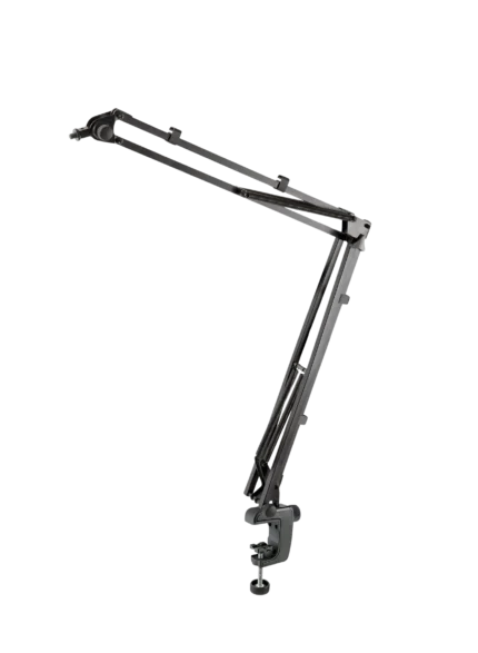K&M microphone desk arm mounted on studio desk with microphone positioned for recording