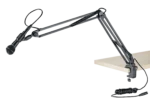 K&M microphone desk arm mounted on studio desk with microphone positioned for recording