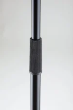 K&M black microphone stand shown from side angle with adjustable boom arm and weighted base