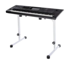 K&M table-style keyboard stand in pure white positioned with keyboard in home studio setting