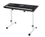 K&M table-style keyboard stand in pure white positioned with keyboard in home studio setting