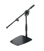 K&M tabletop floor microphone stand with short boom arm in black finish, lifestyle setup