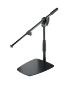 K&M tabletop floor microphone stand with short boom arm in black finish, lifestyle setup