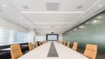 Shure IntelliMix P300 conferencing processor displayed in professional meeting room environment with integrated audio system