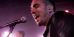 Shure P9HW PSM 900 wired bodypack personal monitor worn by performer on stage during live event