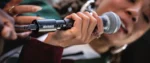 Shure PGA58 dynamic vocal microphone shown from side profile with XLR connector visible