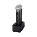 Shure SBC203 dual-channel battery charger with AA batteries installed during charging application