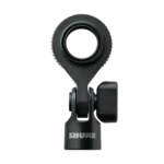 Shure SM4 condenser microphone positioned on desk with pop filter and boom arm for home recording