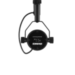 Shure SM7B dynamic microphone mounted on boom arm in professional studio recording setup