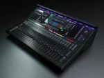 Allen & Heath SQ6+ digital mixer showing fader bank and touchscreen interface from side angle