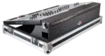 ProX ATA flight case for Behringer WING digital mixer with doghouse compartment and caster wheels in studio setup
