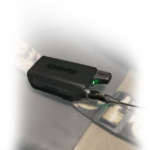 Shure GLXD16+ digital wireless guitar pedal system shown from side profile with integrated footswitch