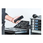 Sennheiser EW-D AB active antenna booster mounted on wireless microphone system in live performance application
