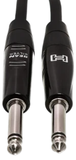 Hosa HGTR-025 25-foot pro guitar cable connected between electric guitar and amplifier in studio application